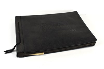 Lot 31 - A photograph album of naval photographs taken...