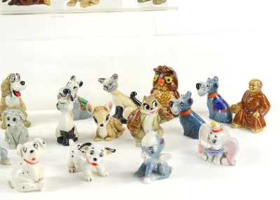 Lot 155 - A collection of Wade Whimsies and figurines to...