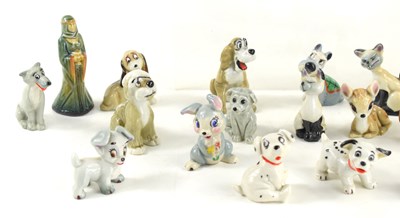Lot 155 - A collection of Wade Whimsies and figurines to...