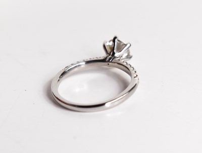 Lot 11 - A platinum and diamond solitaire ring, the...