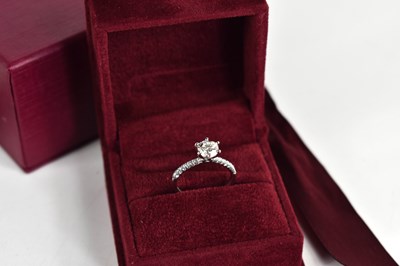 Lot 11 - A platinum and diamond solitaire ring, the...