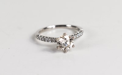 Lot 11 - A platinum and diamond solitaire ring, the...