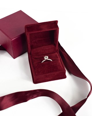 Lot 11 - A platinum and diamond solitaire ring, the...