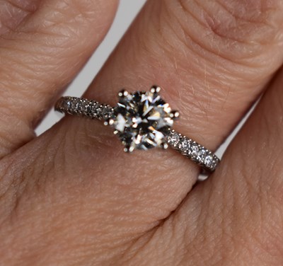 Lot 11 - A platinum and diamond solitaire ring, the...