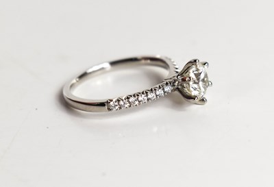 Lot 11 - A platinum and diamond solitaire ring, the...