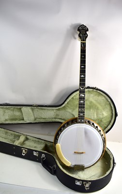 Lot 181 - A Clifford Essex "Paragon" four string banjo,...