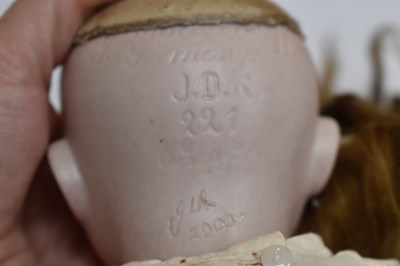 Lot 38 - A Kestner Kewpie bisque head doll, marked JDK...