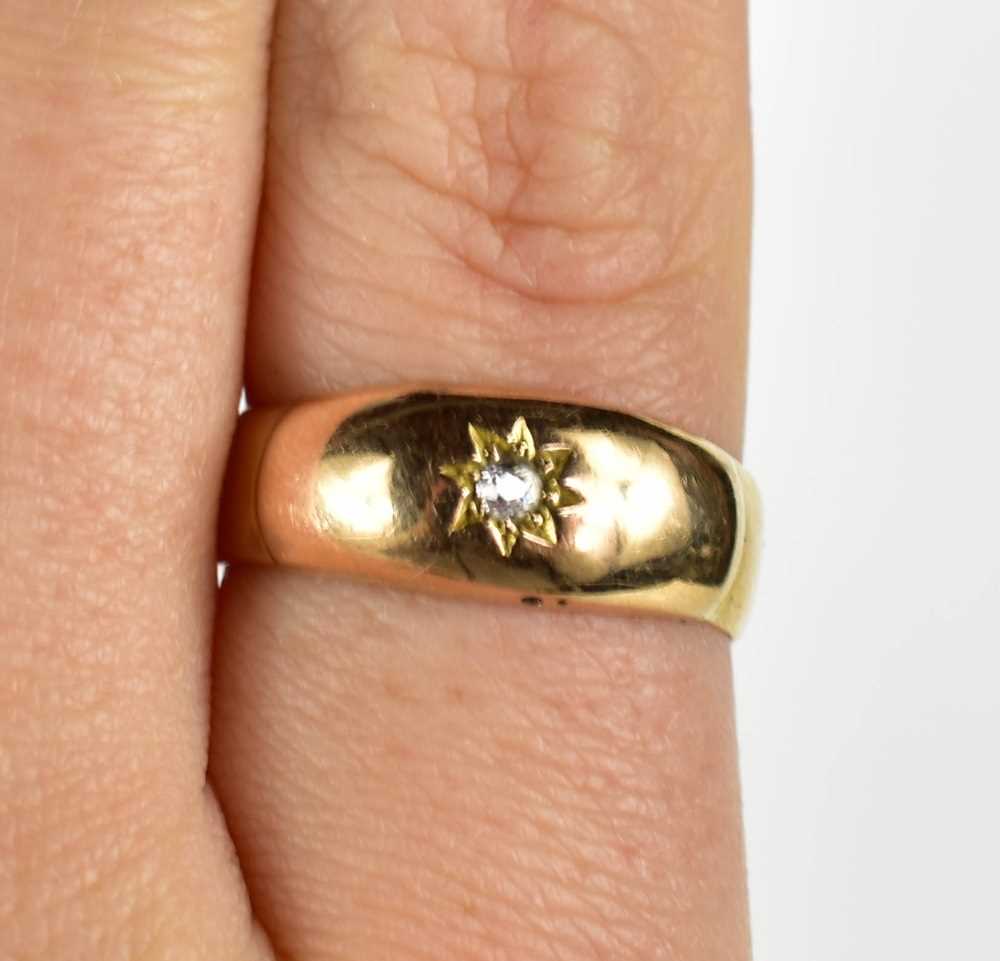 Lot 51 - A 9ct gold and diamond ring, the single...