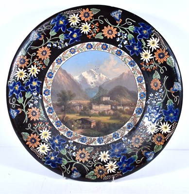 Lot 419 - A Thoune Swiss ceramic charger, made by Schoch...