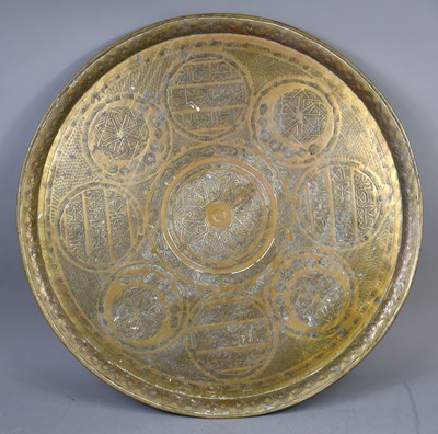 Lot 379 - A Middle Eastern Mamluk Revival brass tray of...