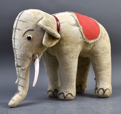 Lot 319 - A vintage Steiff style elephant, 27.5cm high.