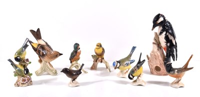 Lot 318 - A group of eight Goebel porcelain birds to...