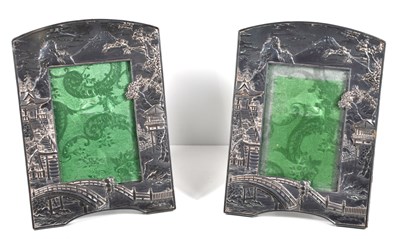 Lot 567 - A pair of Japanese silver plated picture...