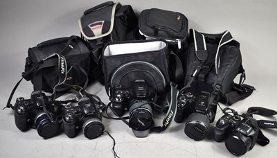Lot 386 - A group of cameras comprising two Fujifilm...