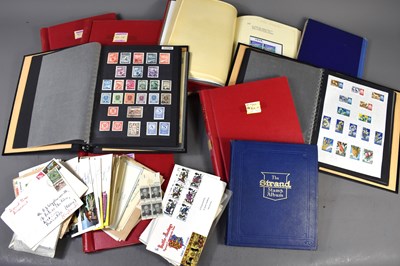 Lot 484 - A group of stamp albums containing mint...