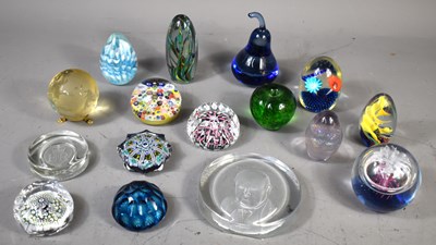 Lot 254 - A group of glass paperweights to include...