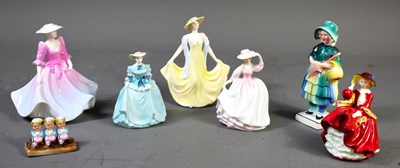 Lot 234 - A group of porcelain figures to include...