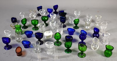 Lot 236 - A large group of glass eye cups to include...