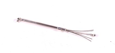 Lot 25 - A silver retractable swizzle stick / cocktail...