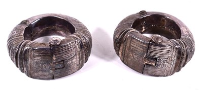 Lot 583 - A pair of Omani hinged anklets, decorated with...