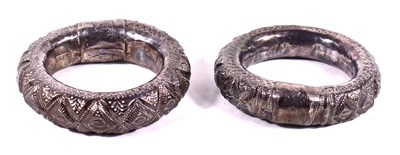Lot 577 - A pair of Omani Bahla white metal rattle...