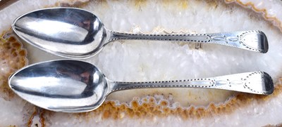 Lot 66 - A pair of Georgian silver serving spoons, with...