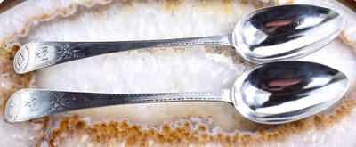 Lot 67 - A pair of Georgian silver serving spoons, with...