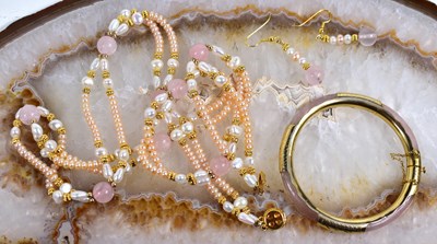 Lot 40 - A rose quartz and faux pearl multi strand...