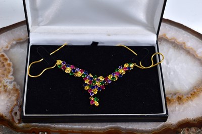 Lot 26 - A gilt metal and multi-colour gemstone set...