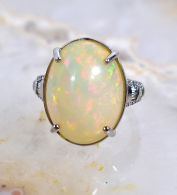Lot 108 - A Rhapsody opal, diamond and platinum...