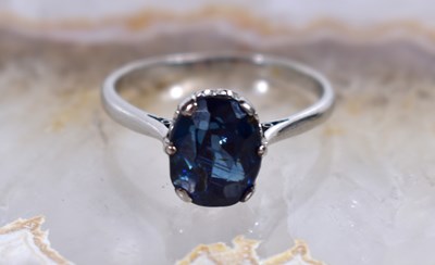 Lot 109 - A Platinum and sapphire solitaire ring, the...