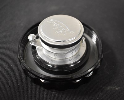 Lot 397 - A Leica Leitz camera lens with case.