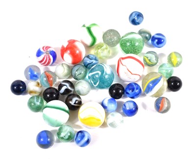 Lot 564 - A collection of vintage marbles to include...
