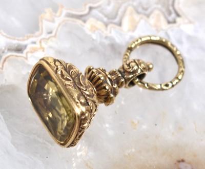 Lot 101 - A Victorian gold and citrine fob, 24.1g.