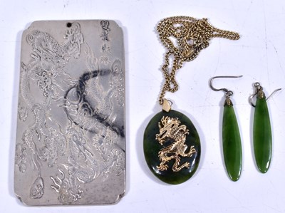 Lot 34 - A Chinese spinach green jade and yellow metal...