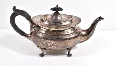 Lot 55 - A silver bachelors teapot with ebonised handle...