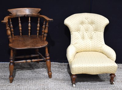 Lot 615 - A Victorian elm smokers bow armchair together...
