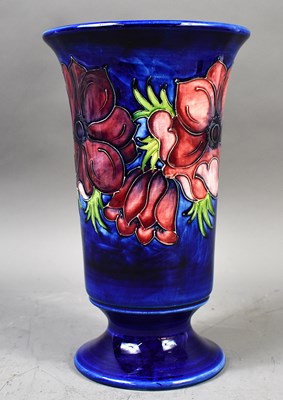 Lot 297 - A Moorcroft vase with Anemone design on blue...