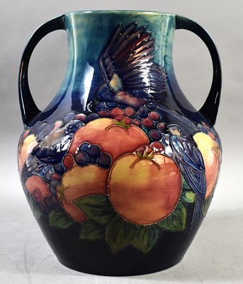 Lot 337 - A twin handled Moorcroft vase with Fruits and...