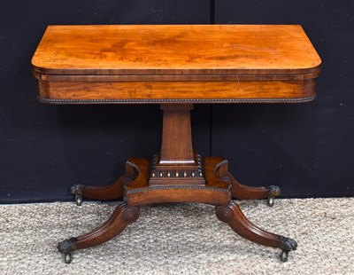 Lot 633 - A Regency rosewood fold over card table, with...