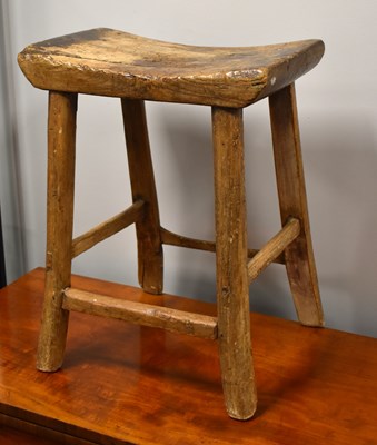 Lot 618 - A 19th century elm milking stool with curved...