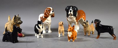 Lot 308 - A selection of Beswick pottery dog figurines,...