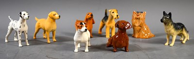 Lot 305 - A selection of Beswick pottery dog figurines,...