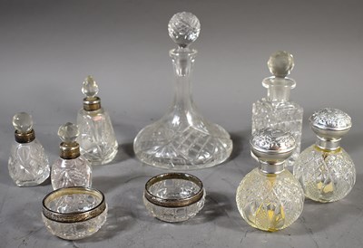Lot 36 - A group of silver rimmed scent bottles...