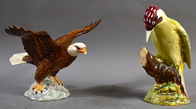 Lot 328 - Two Beswick bird figurines: Bald Eagle 1018,...