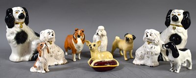 Lot 220 - A group of Beswick pottery dog figurines:...