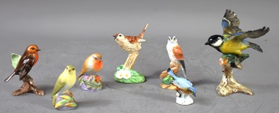 Lot 221 - A group of porcelain model birds to include...