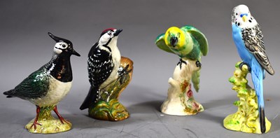 Lot 302 - A Beswick pottery group of birds, to include a...