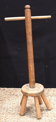 Lot 601 - An antique elm wash dolly, raised on five feet,...
