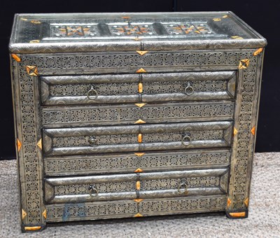 Lot 626 - A Moroccan white metal and bone clad chest of...